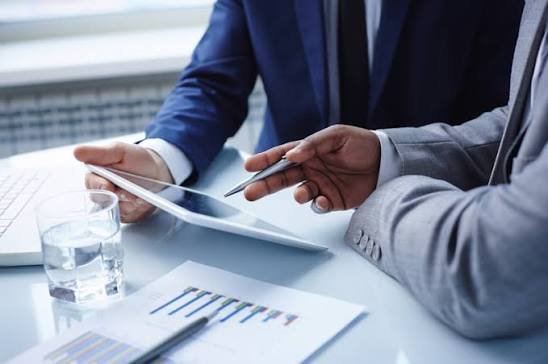 Business advisor discussing financial strategy with owners